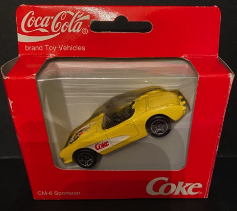 10159-1 € 3,50 coca cola auto cabrio geel.jpeg